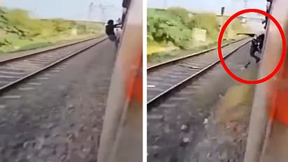 man standing train door died