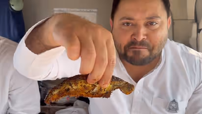 Tejashwi Yadav eats fish in helicopter