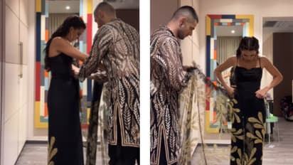 Natasa-stankovic-friend-Alexander-helping-her-to-wear-saree