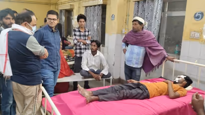 Administrative officer inquiring about the condition of a youth injured in an accident in Rajasthan