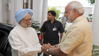 Narendra Modi with Manmohan Singh
