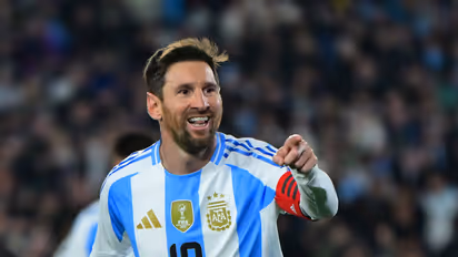 Lionel Messi celebrates after scoring goal against Venezuela
