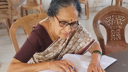 78-year-old Chandrika Devaraj writing her Saksharatha Mikavolsavam exam with confidence at Thrissur