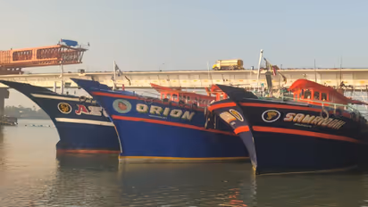 Fisheries and Coastal Police team inspecting seized fishing boats at Azhikode harbor after a midnight operation
