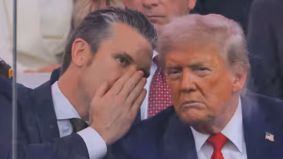 US Secretary of Defence Pete Hegseth talks to US President Donald Trump during the US Army's 250th Birthday parade (Image/Reuters)