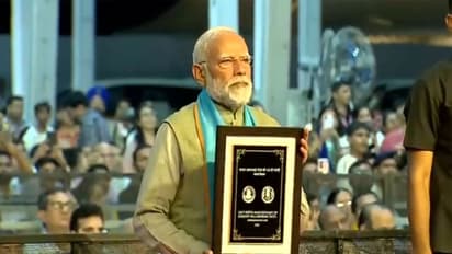 PM Modi Unveils Coin and Stamp for Sardar Patels 150th Birth Anniversary in Gujarat