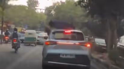 Couple kissing on moving Car