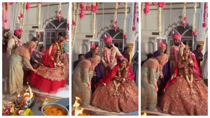 bride and groom walking around a fire with friends