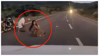 couple who lied in the middle of the road for a selfie