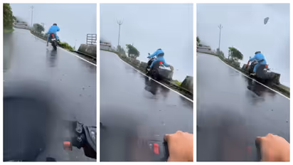 biker's daring escape on slippery road