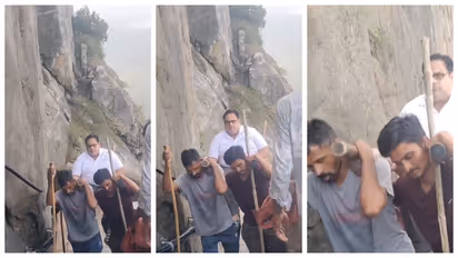 Four men carrying a pilgrim