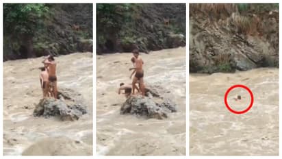 Students jump into a raging river