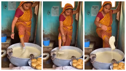 Woman kneads dough with her feet inside toilet