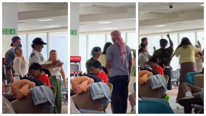 Foreigners sing and dance at Delhi airport