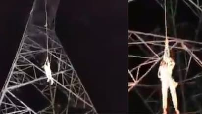 Man Climbs 40ft High Transmission Line