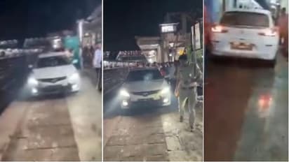 Man drives car on railway platform