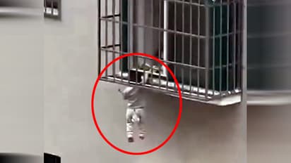 innocent child trapped in high rise building window