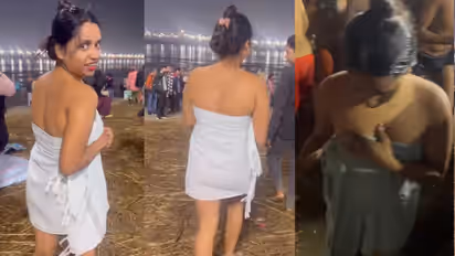 mahakumbh 2025 sangam girl in towel viral video reel controversy social media outrage