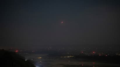 India's air defence system intercepts objects in the sky during a blackout following multiple blasts in the city of Jammu