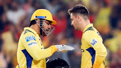 Chennai Super Kings' former captain MS Dhoni in conversation with bowler Noor Ahmad