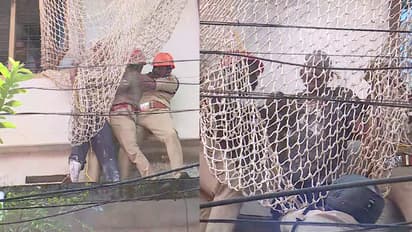 Youth caught for threatening suicide by climbing onto building roof