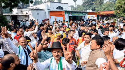Workers and supporters celebrate JD(U) candidate from Mokama, Anant Singh's lead in Bihar assembly elections