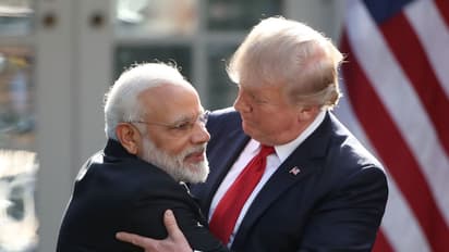 PM Modi (left) hugging US President Donald Trump