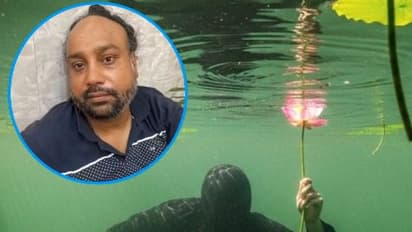 thief avoid police by hiding in pond
