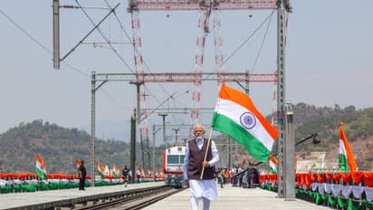 PM Modi waves the Tiranga as he inaugurates the Chenab bridge - the world’s highest railway arch bridge