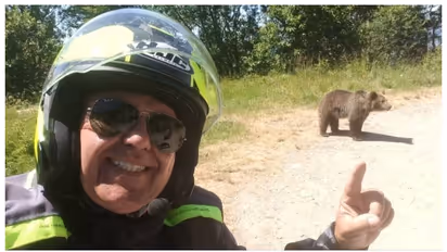 Omar Farang Zin last selfie with a bear cub
