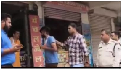 police led the criminal along the street and made him apologize