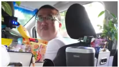 car driver offer food and games to his passengers