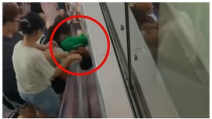 rescue operation boy's head trapped in Escalator and wall