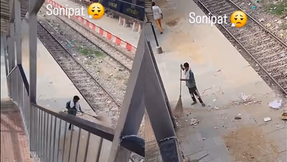 Watch: Sanitation Worker Sweeps Trash Onto Railway Tracks at Sonipat Station, Video Sparks Outrage
