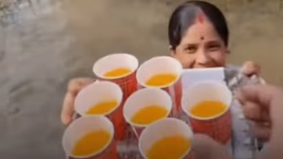 Assam Floods: Woman Serves Juice To Relief Workers While Standing Waist-Deep In Floodwater, Video Goes Viral