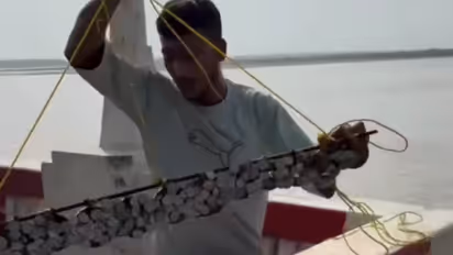 Digital Creator Pulls Hundreds Of Coins From River Using Giant Magnet