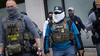 ICE officials in mask