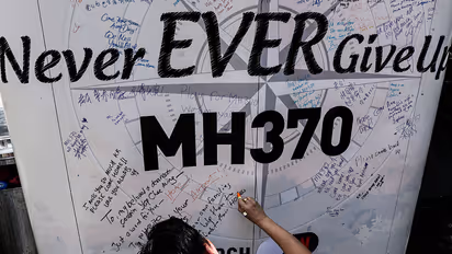 Son of MH370 flight victim seeks answers after 11 years