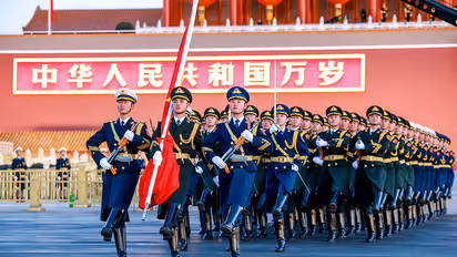 Members of Chinese People's Liberation Army (PLA) honour guard march during a flag-raising ceremony at Tian'anmen Square on New Year's Day.