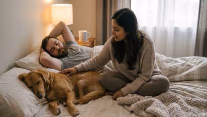 women sleeping with dog