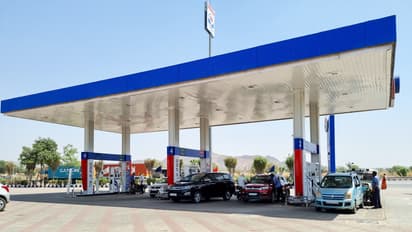 Delhi petrol pump with cars getting fuel