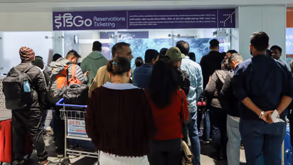 Passengers wait at the airport as IndiGo’s flight disruptions continue