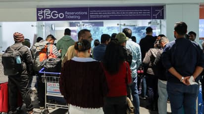 Passengers wait at the airport as IndiGo’s flight disruptions continue