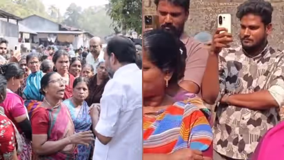 PC Vishnunath MLA interacting with cashew workers and the SFI leader recording the video in the background