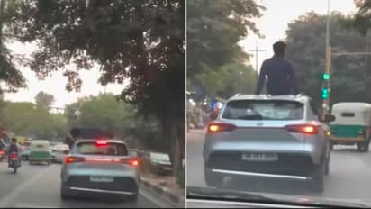 couples dangerous kissing stunt in moving car video viral