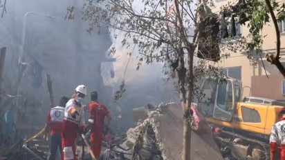 Rescuers work at the site of a damaged building, in the aftermath of Israeli strikes in Tehran, Iran, June 13 (Photo/Reuters)