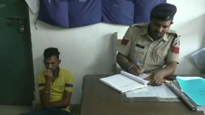 young man man beating dog video viral arrested 