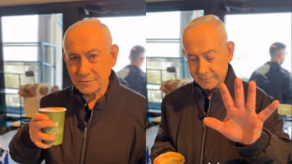Israeli PM Benjamin Netanyahu showing his fingers to the camera in a cafe to debunk AI generated video rumors Israeli PM Benjamin Netanyahu showing his fingers to the camera in a cafe to debunk AI generated video rumors