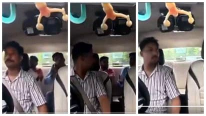 Passenger smoking a cigarette inside taxi