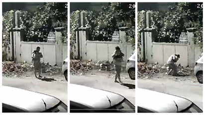 man dumps garbage in public place
